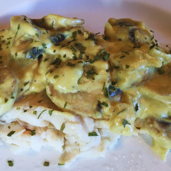 Whitefish covered in delicious yellow sauce