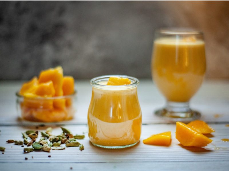 This photograph shows mango sauce in a jar.