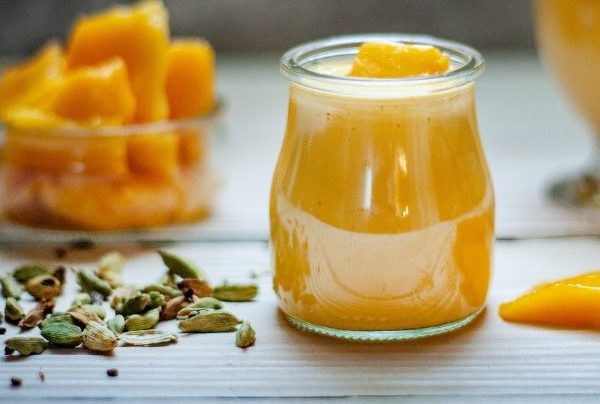This photograph shows mango sauce in a jar.