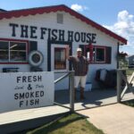 Bill Bodin outside of the market where he processes and markets fresh and smoke fish.